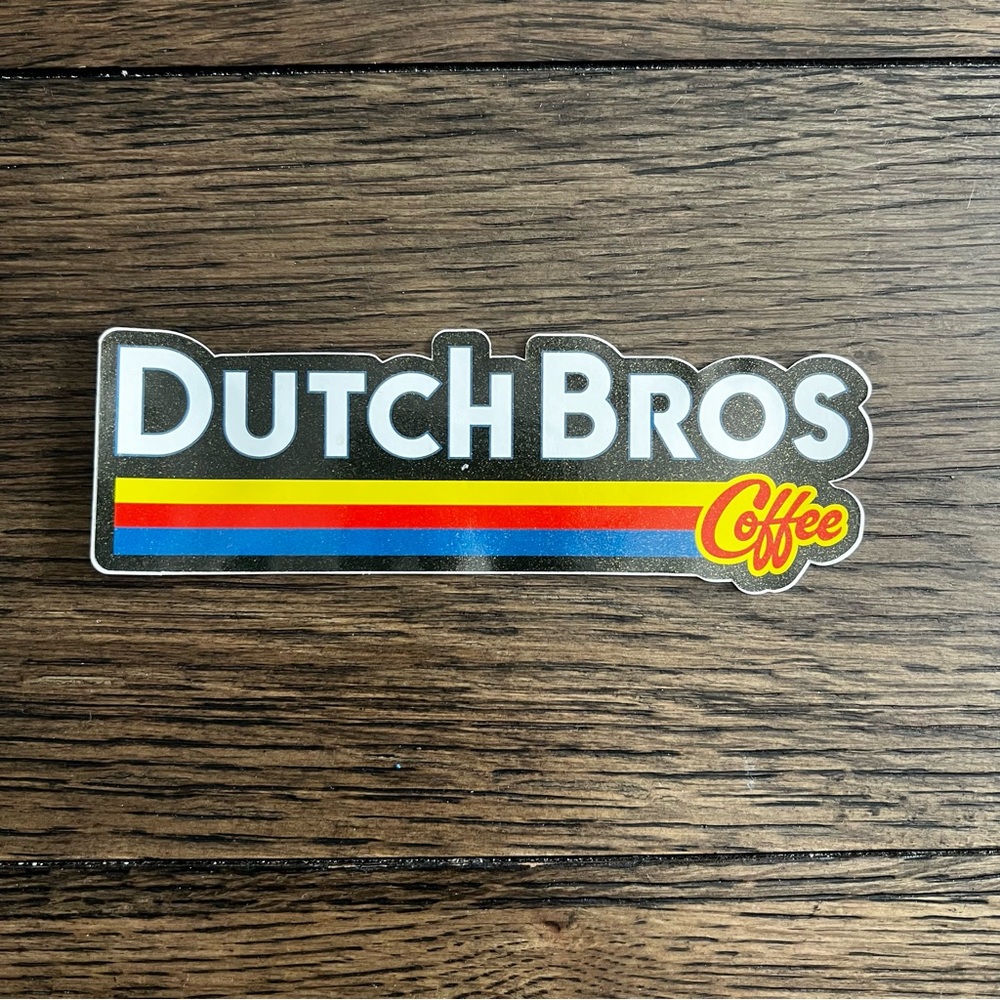 Dutch Bros Sticker with Black, Yellow, Red & Blue Stripes